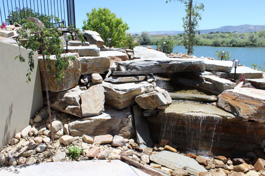 Waterfall and pond feature planned as a part of a residential landscaping project in Twin Falls, ID
